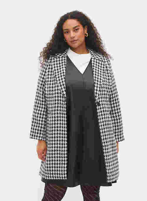 Checkered jacket with button closure