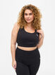 Sports bra with cross detail in the back, Black, Model image number 0