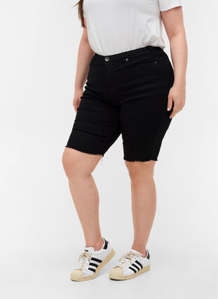 Close-fitting denim shorts with raw hems, Black, Model image number 2