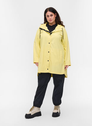 Rain coat with a hood and pockets, Pale Banana, Model image number 2