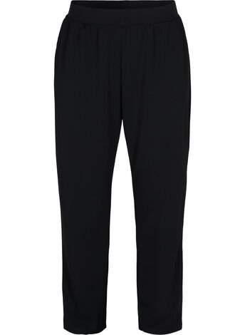 Loose trousers with elasticated waist