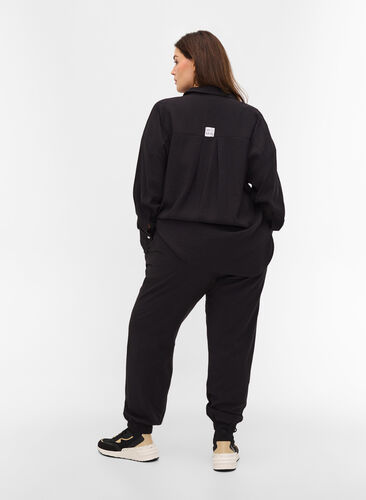 Loose viscose trousers with elastic borders and pockets, Black, Model image number 1