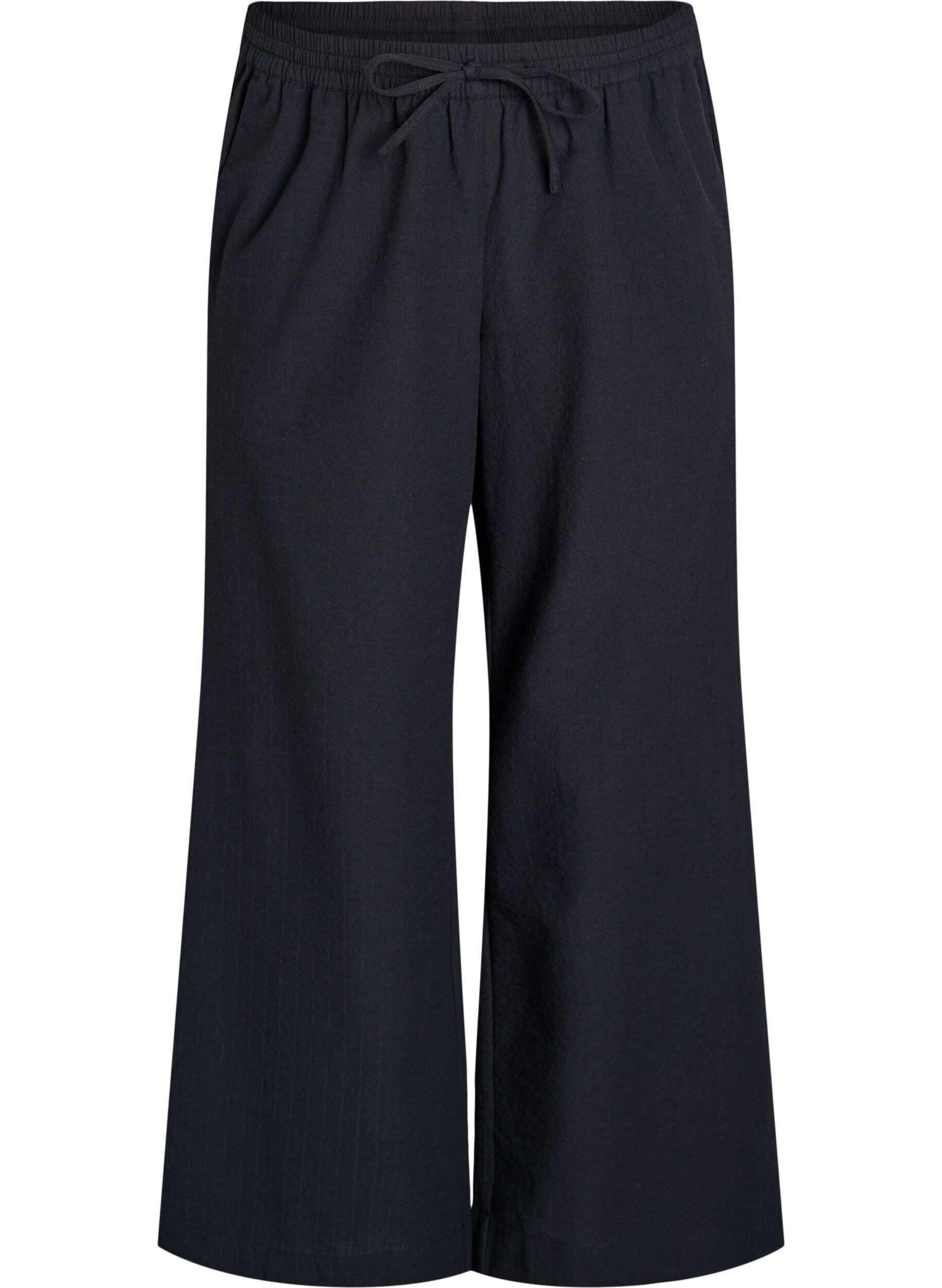 Loose trousers with high waist and pockets