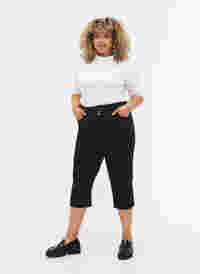 	 Tight-fitting high-waisted capri trousers, Black, Model