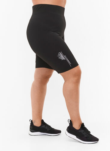 Tight-fitting workout shorts with logo, Black, Model image number 0