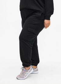 Sweatpants with cargo pockets, Black, Model