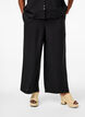 Loose trousers with elasticated waistband and pockets, Black, Model image number 2