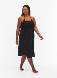 Beach dress in viscose with smock top, Black, Model