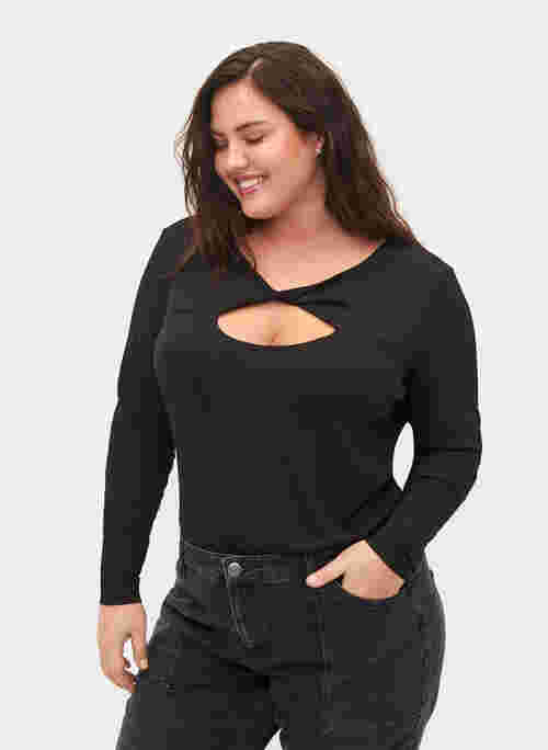 Top with cut out detail and long sleeves