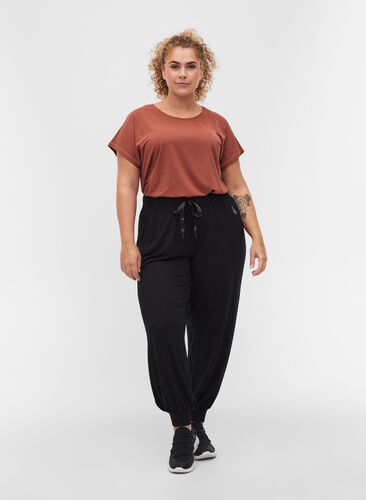 Loose, viscose sports trousers, Black, Model image number 0