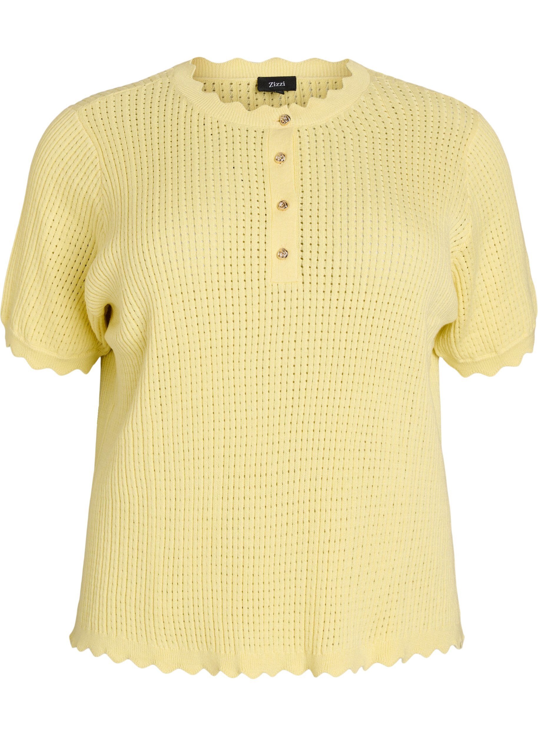 Short-sleeved knit blouse with openwork pattern and wavy edges
