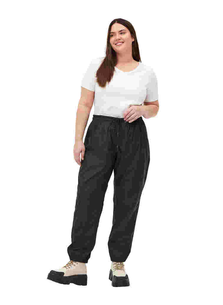 Rain trousers with taped seams, Black, Model image number 4