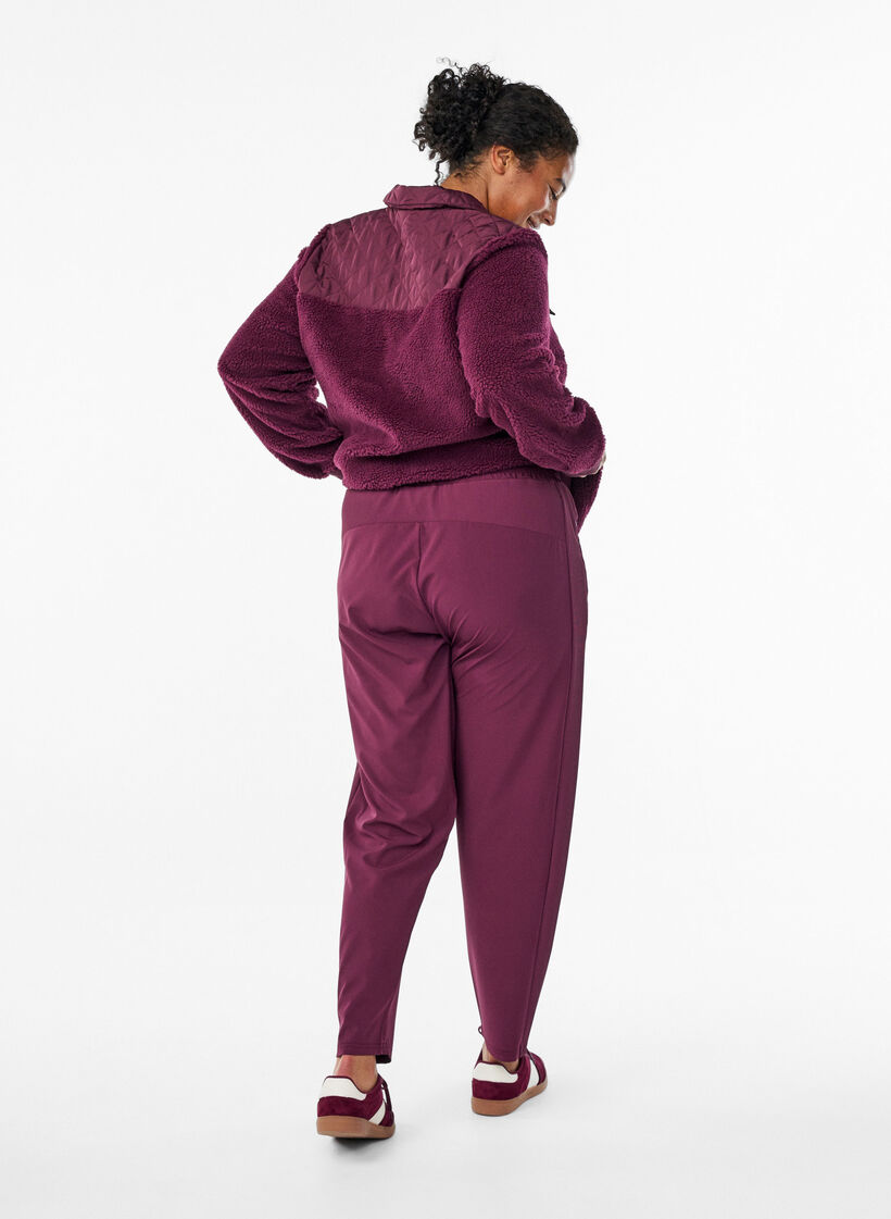 Lightweight training trousers with pockets, Red, Model image number 1