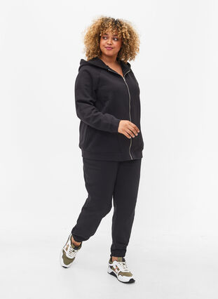Loose cotton trousers with pockets, Black, Model image number 0
