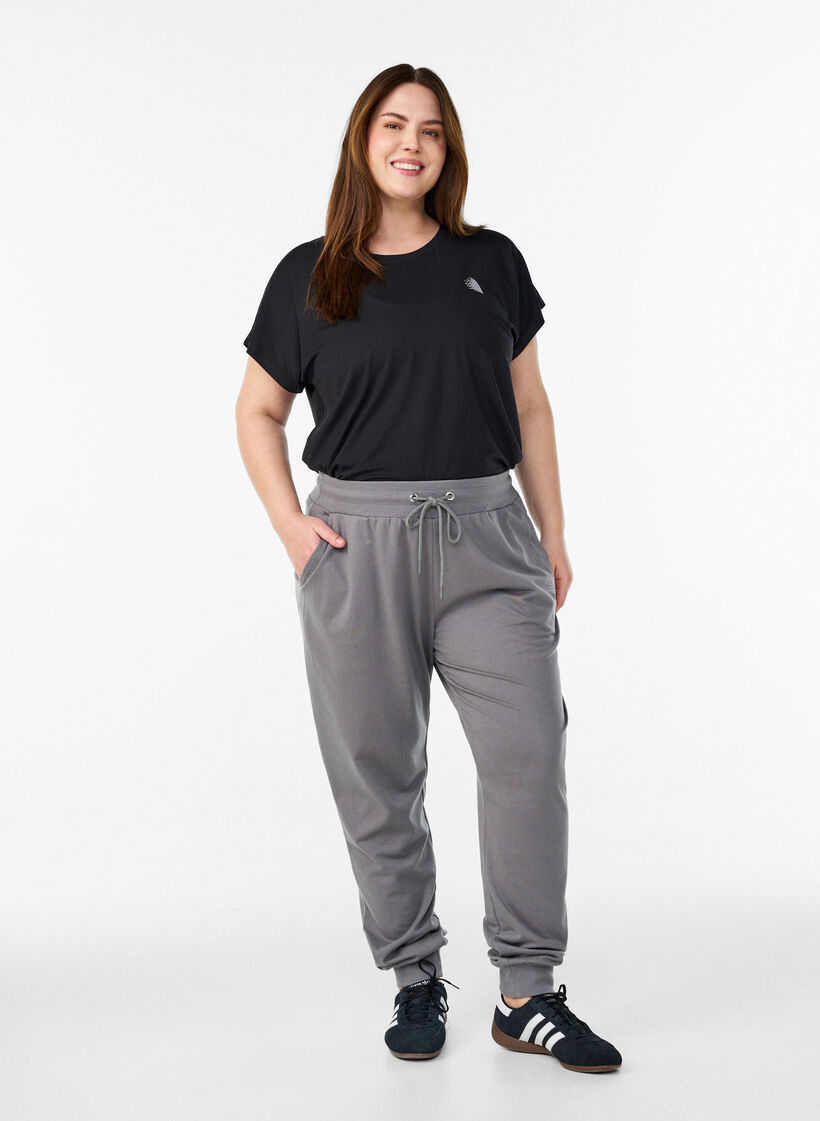 Loose tracksuit trousers with pockets, Grey, Model image number 1