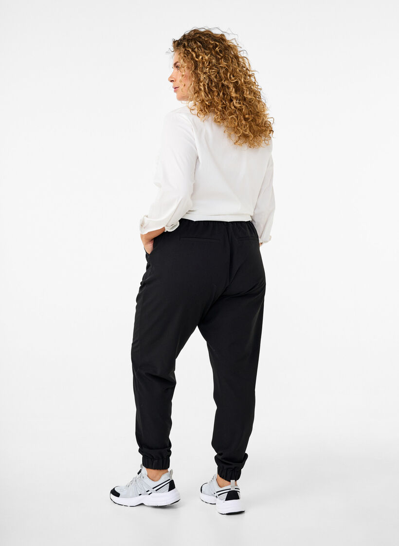 Trousers with elasticated waist and ankle, Black, Model image number 1