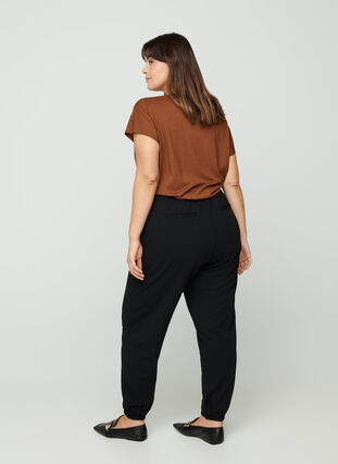 Loose trousers with pockets, Black, Model image number 0