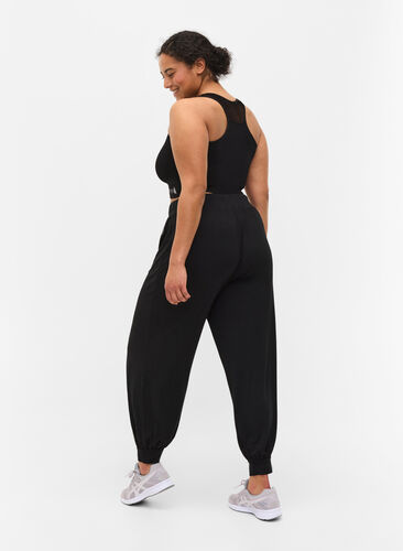 Loose viscose exercise trousers, Black, Model image number 0