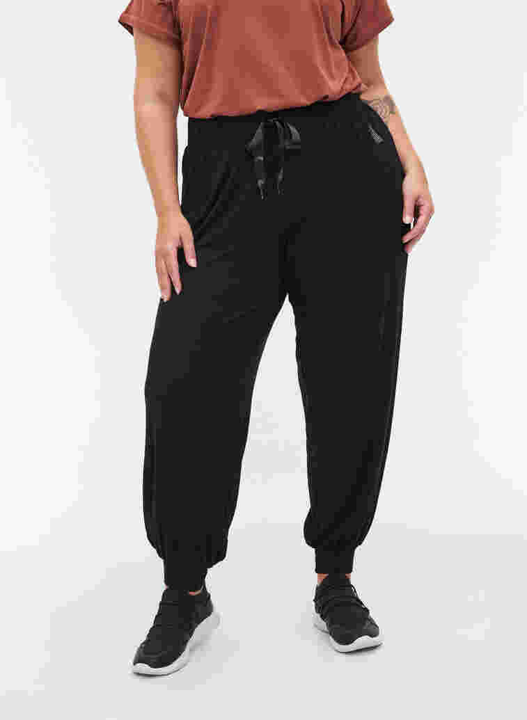 Loose, viscose sports trousers, Black, Model image number 2
