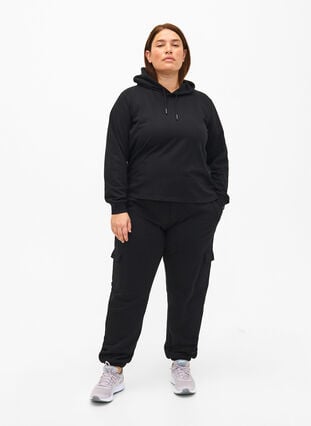 Sweatpants with cargo pockets, Black, Model image number 2
