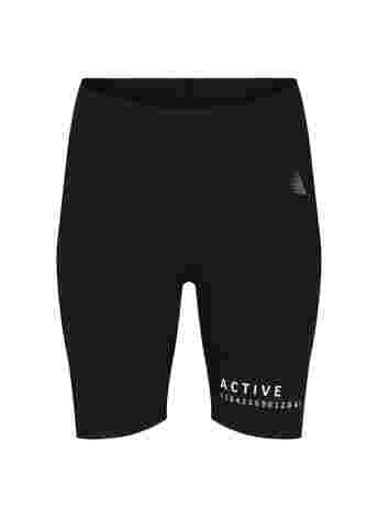 Close-fitting sports shorts with text print