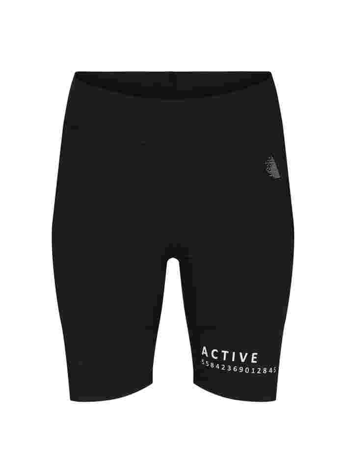 Close-fitting sports shorts with text print, Black, Packshot