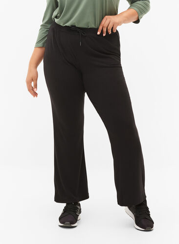 Flared training trousers in rib, Black, Model image number 0