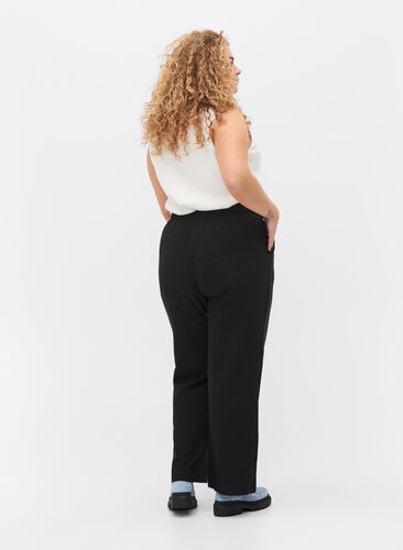 Flared trousers with pockets, Black, Model image number 1
