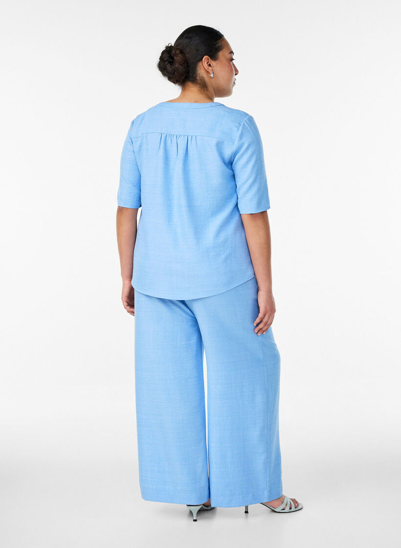 Loose trousers with elasticated waistband and pockets, Light Blue, Model image number 1