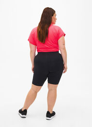Tight-fitting training shorts with pocket, Black, Model
