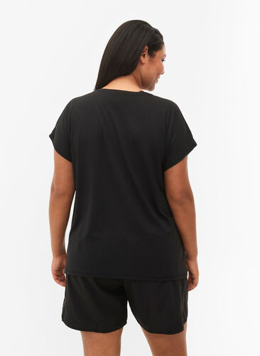 Short-sleeved training T-shirt with print, Black/Pink Print, Model image number 1