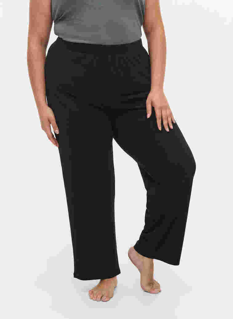Loose trousers with structure, Black, Model image number 1