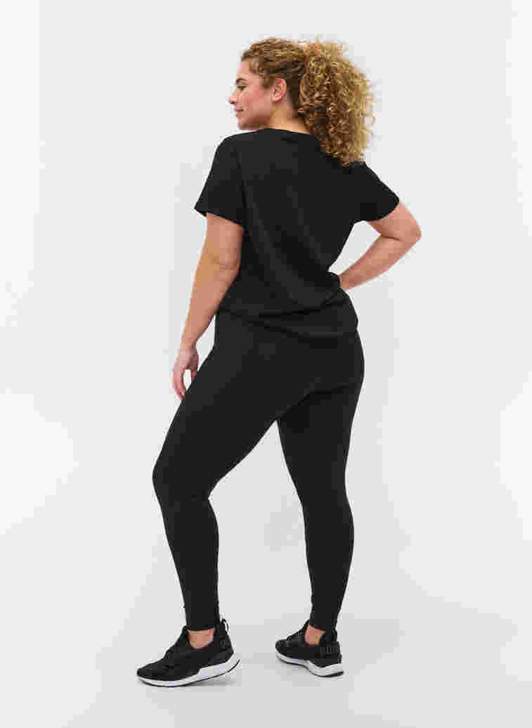 Cropped gym leggings with pocket and reflection, Black, Model image number 1