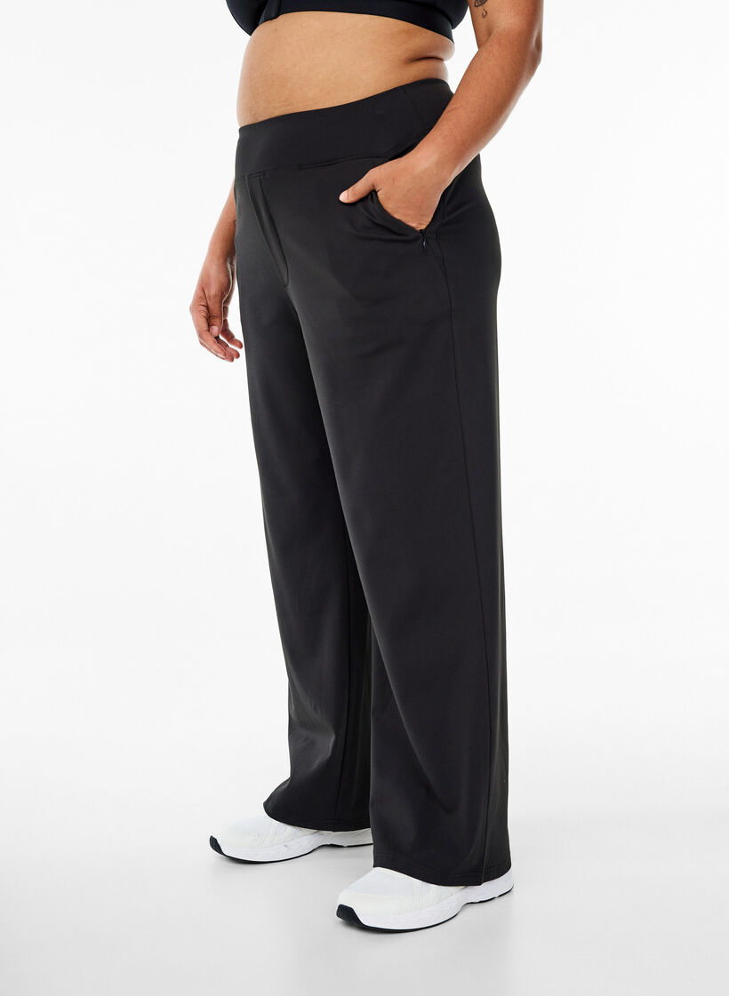 Stylish workout trousers with a slight flare, Black, Model