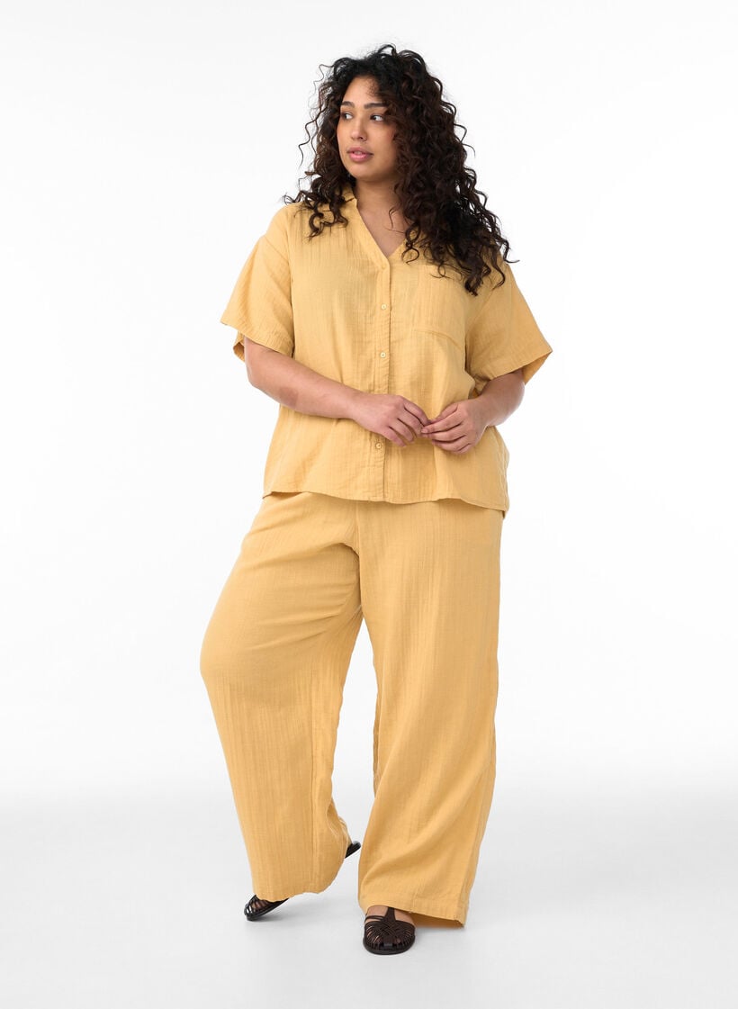 High-waisted cotton muslin trousers with loose legs, Yellow, Model image number 0