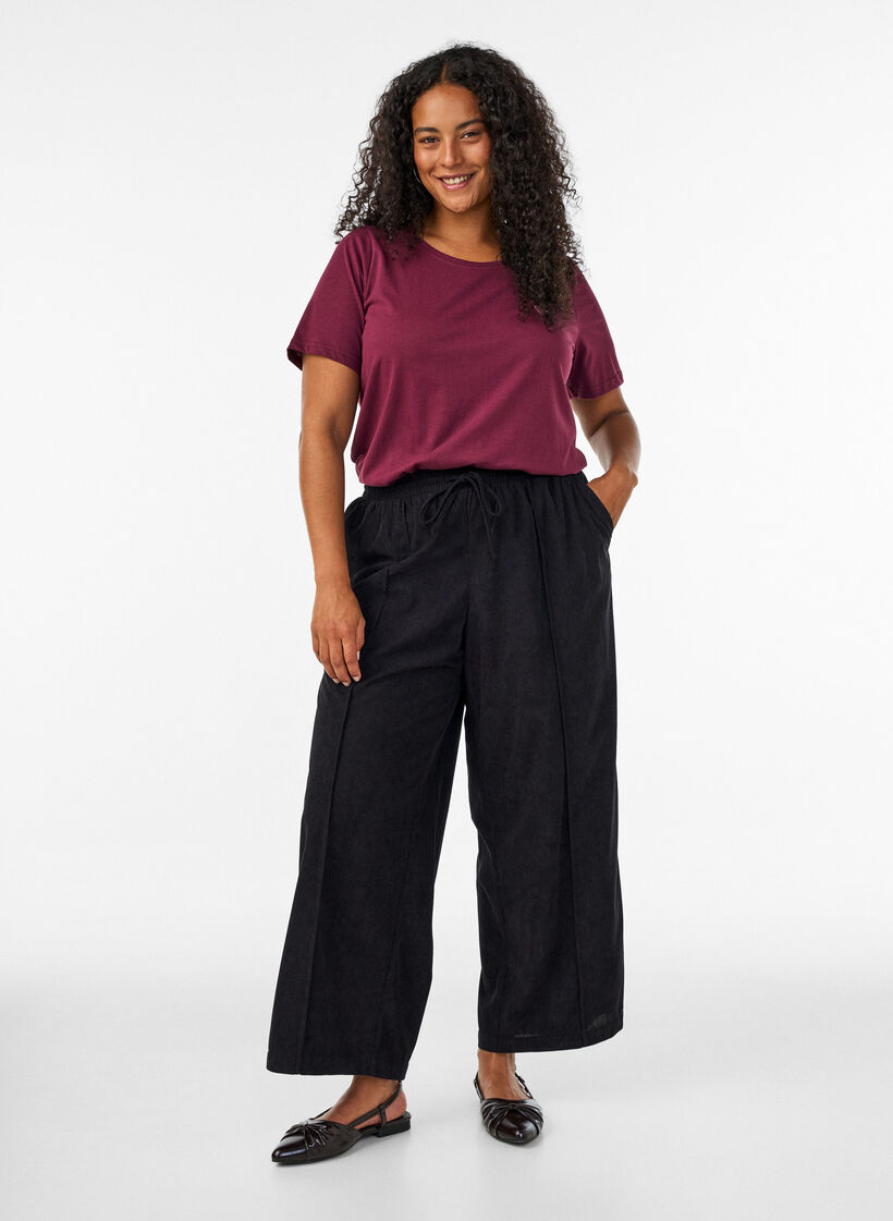 Corduroy trousers with wide legs and a high waist, Black, Model image number 0