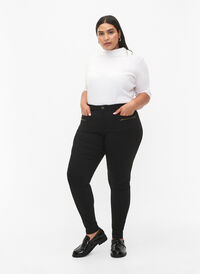 Close-fitting trousers with zipper details, Black, Model