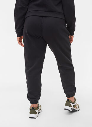 Loose cotton trousers with pockets, Black, Model image number 1
