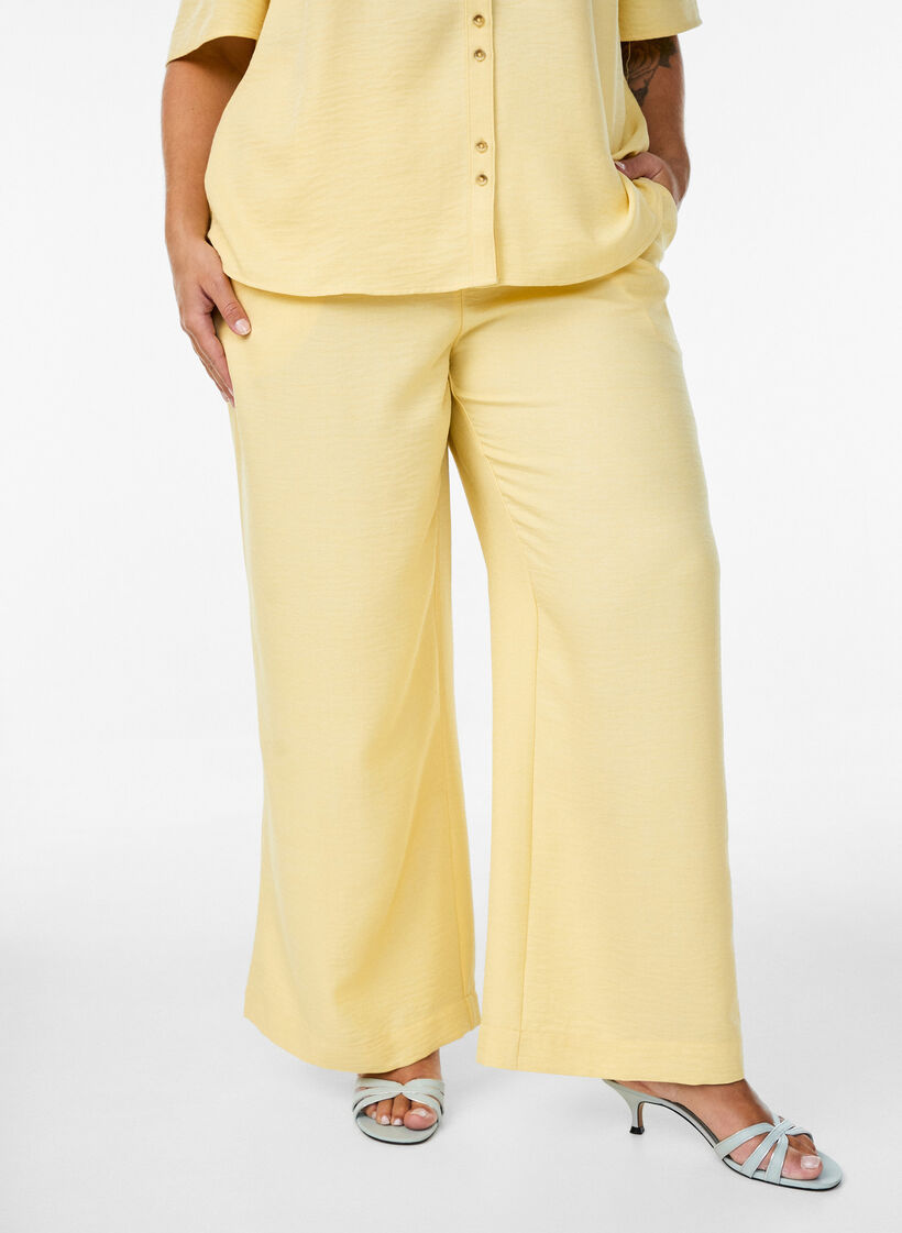 Loose trousers with elasticated waistband and pockets, Yellow, Model image number 2