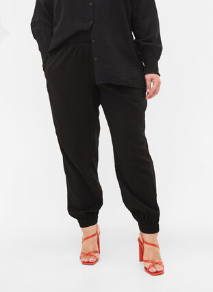 Loose viscose blend trousers with elastic trim, Black, Model image number 2