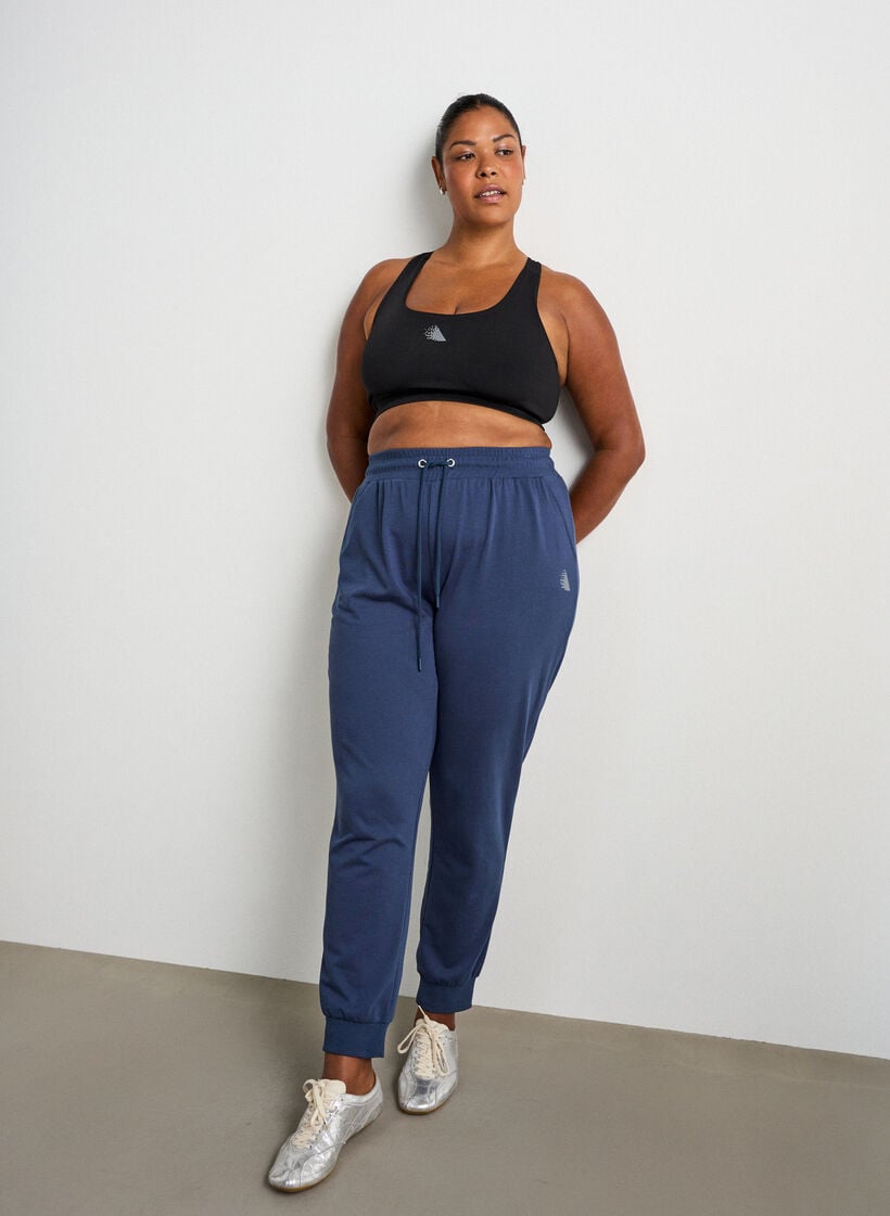 Loose tracksuit trousers with pockets, Blue, Model image number 0
