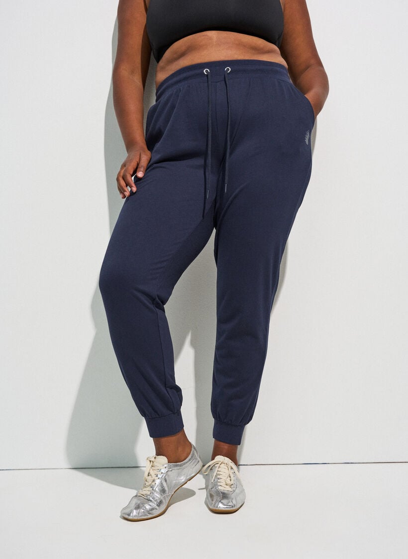 Loose workout trousers with pockets, Blue, Model image number 0