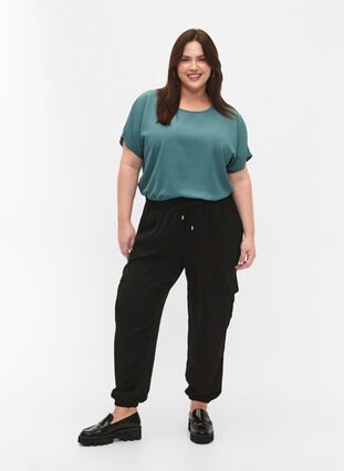 Trousers with cargo pockets, Black, Model image number 0
