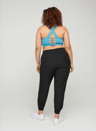Loose exercise trousers with pockets, Black, Model image number 1
