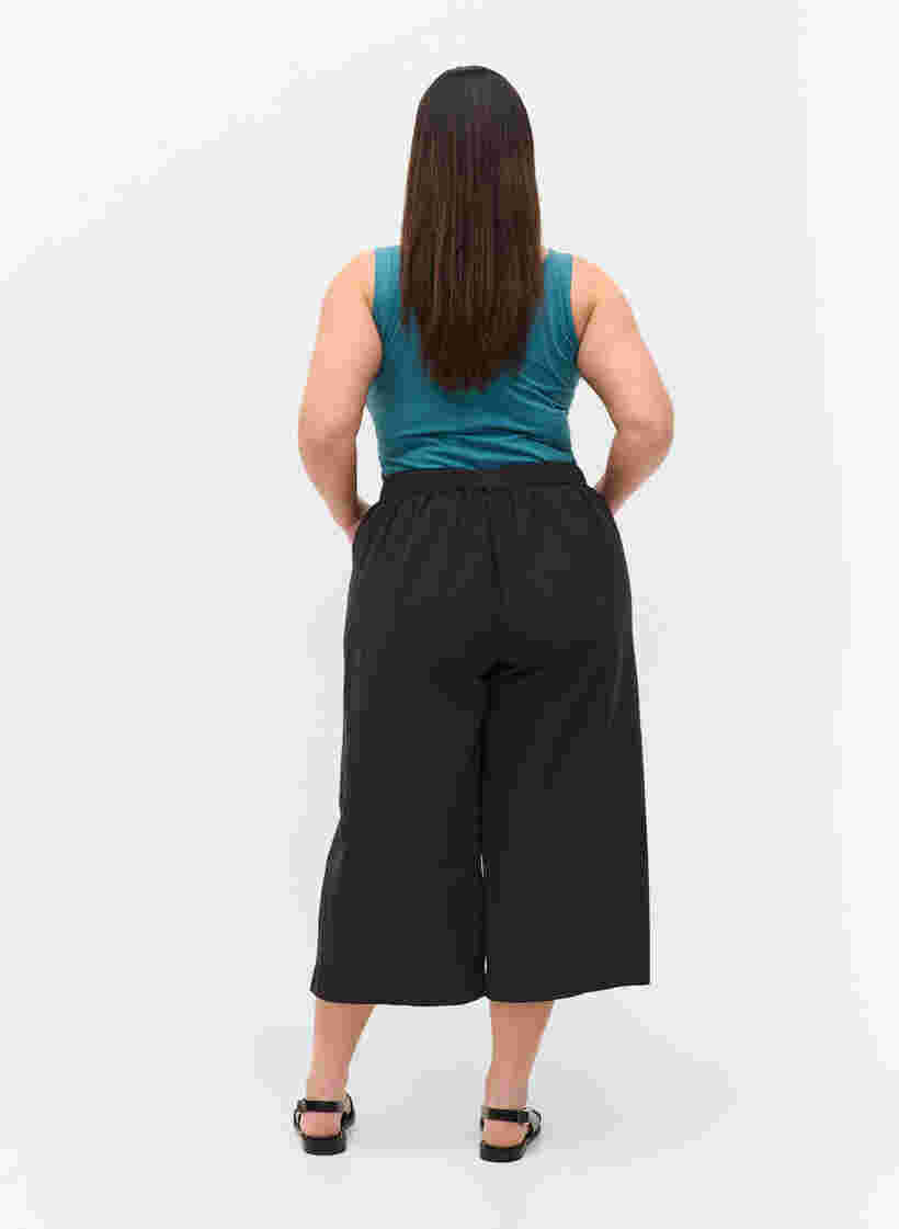 Loose culotte trousers in cotton, Black, Model image number 0
