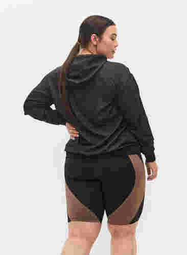 Tight fitted training shorts, Black w. Deep Taupe, Model image number 1