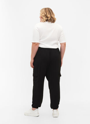 Plain cargo pants with large pockets, Black, Model image number 1