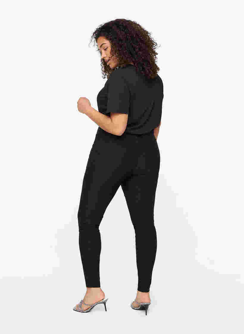 Close-fitting trousers with zipper details, Black, Model image number 1