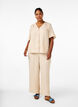 Loose trousers with elasticated waistband and pockets, Beige, Model image number 0