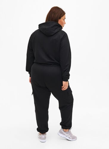 Sweatpants with cargo pockets, Black, Model image number 1